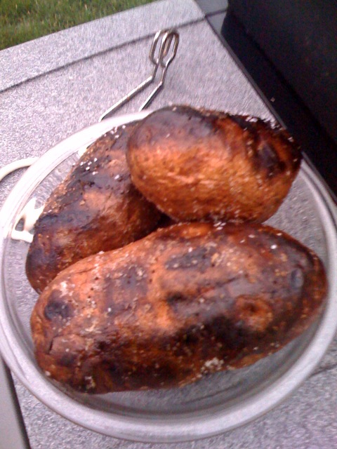 Grill baked potatoes